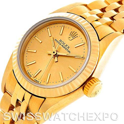 The image shows a close-up angled view of a Rolex President 67197 Women's Yellow Gold Champagne Dial 67197 Women's Yellow Gold Champagne Dial model watch, highlighting the face, bezel, crown, and part of the bracelet.