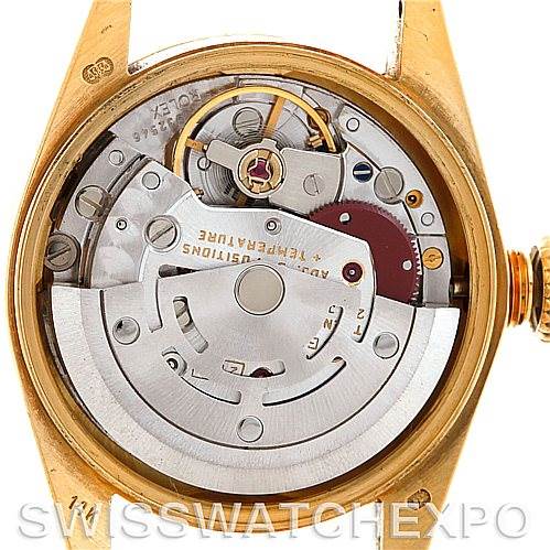 The image shows the internal mechanism and movement of a Rolex President 67197 Women's Yellow Gold Champagne Dial 67197 Women's Yellow Gold Champagne Dial model watch from a rear, open-case angle.