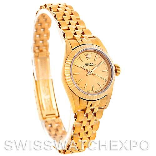 This image shows a Rolex President 67197 Women's Yellow Gold Champagne Dial 67197 Women's Yellow Gold Champagne Dial model watch from an angled side view, displaying the face, bezel, bracelet, and clasp.