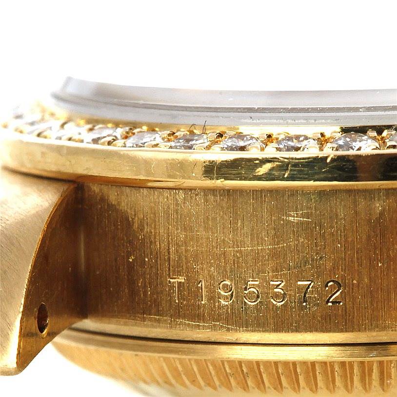 This image shows the side view of the bezel and case of a Rolex President 69138 Women's Yellow Gold Blue Dial 69138 Women's Yellow Gold Blue Dial model watch, highlighting the serial number.