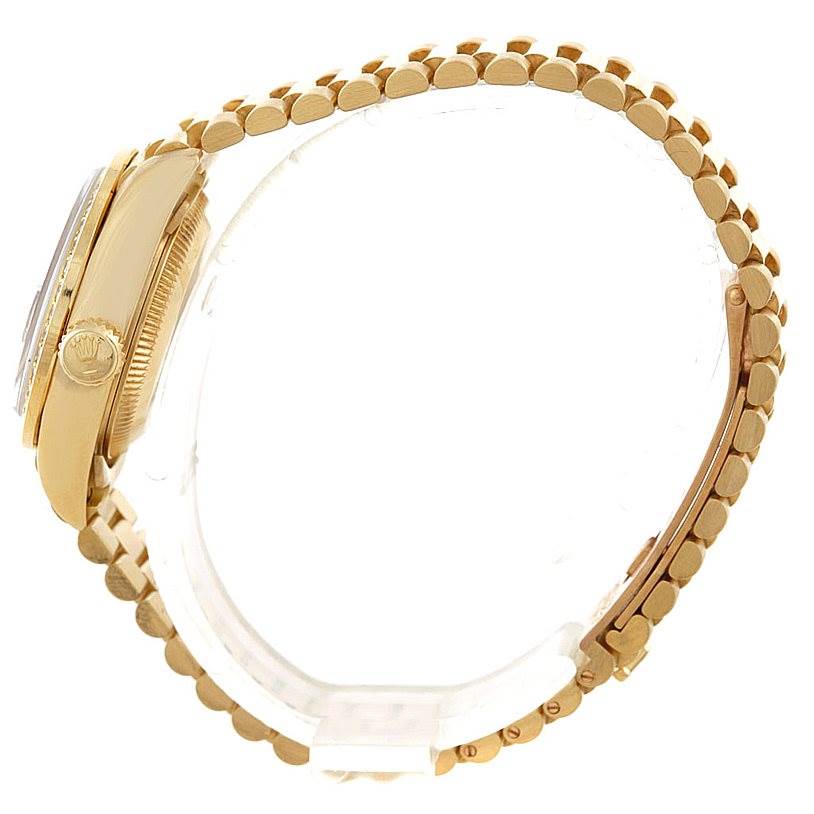 The image shows a side view of a Rolex President 69138 Women's Yellow Gold Blue Dial 69138 Women's Yellow Gold Blue Dial model watch, highlighting the crown, case, and bracelet.