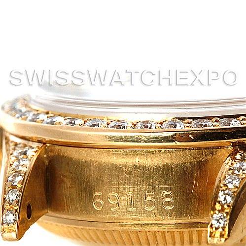 This image shows a close-up view of the Rolex President 69158 Women's Yellow Gold Champagne Dial 69158 Women's Yellow Gold Champagne Dial model's bezel and case with the serial number "69158" engraved.