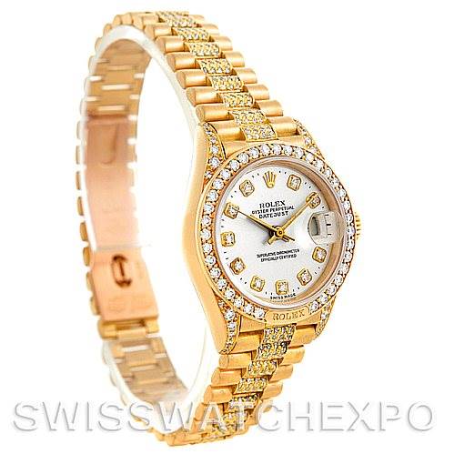 The image shows a Rolex President 69158 Women's Yellow Gold Champagne Dial 69158 Women's Yellow Gold Champagne Dial model watch at a 3/4 angle, highlighting its gold bracelet and diamond-set bezel and dial.