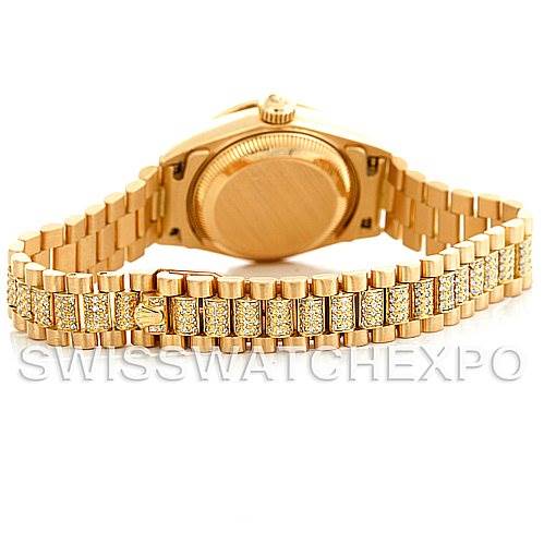 The image shows the back and bracelet of a Rolex President 69158 Women's Yellow Gold Champagne Dial 69158 Women's Yellow Gold Champagne Dial model, with a focus on the gold and diamond-encrusted links.