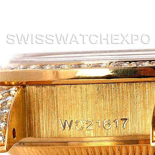 This close-up image shows the side of a Rolex President 69158 Women's Yellow Gold Champagne Dial 69158 Women's Yellow Gold Champagne Dial model watch, highlighting its engraved serial number and part of the case.