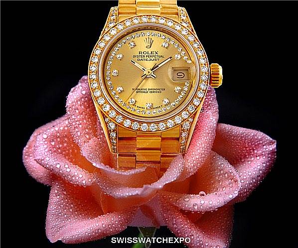 The Rolex President 69158 Women's Yellow Gold Champagne Dial 69158 Women's Yellow Gold Champagne Dial model watch is shown from the front angle, displaying its face, bezel, and part of its bracelet.