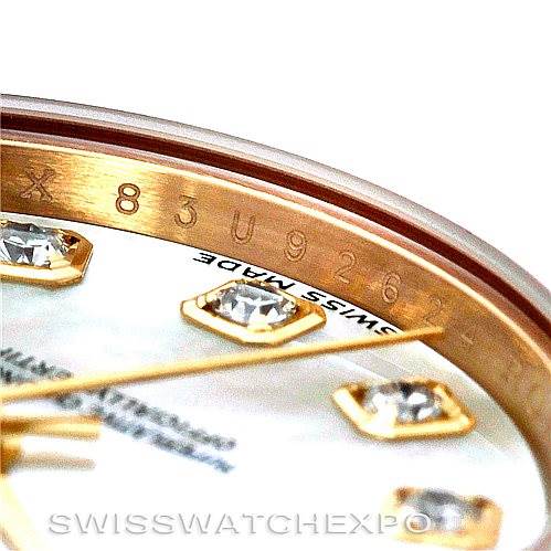 This is a close-up of the dial and bezel of a Rolex President 179138 Women's Yellow Gold Mother of Pearl Dial 179138 Women's Yellow Gold Mother of Pearl Dial model watch, showing diamond markers and part of the serial number. 