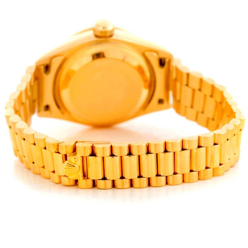 The image shows the back view of a Rolex President 69158 Women's Yellow Gold Black Dial 69158 Women's Yellow Gold Black Dial model watch, focusing on the back case and gold bracelet.