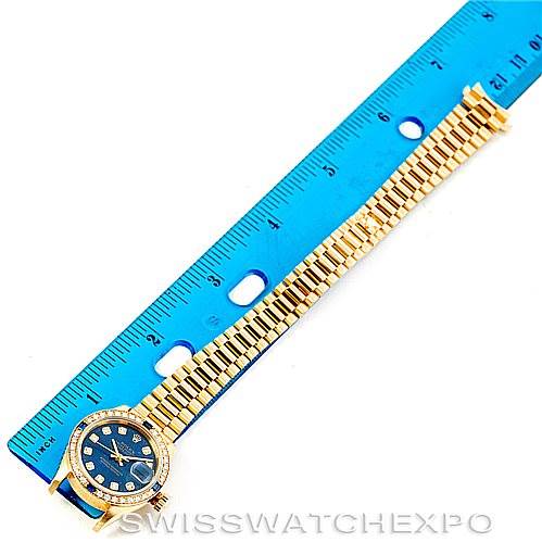The image shows a Rolex President 69088 Women's Yellow Gold Blue Dial 69088 Women's Yellow Gold Blue Dial model watch, photographed from above, with a blue ruler measuring its length.