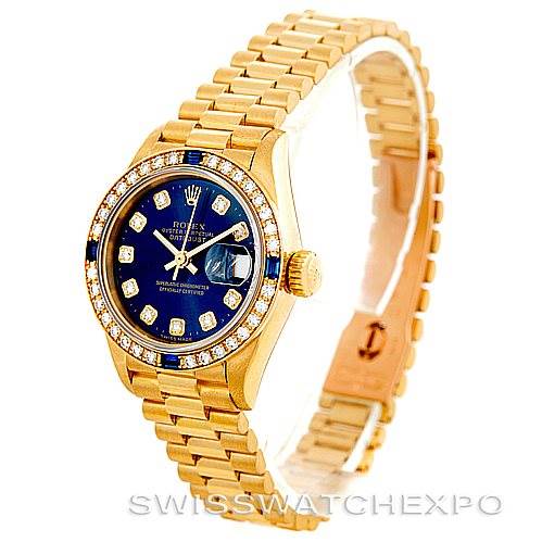 The image shows a Rolex President 69088 Women's Yellow Gold Blue Dial 69088 Women's Yellow Gold Blue Dial model watch angled slightly from the front, displaying its gold bracelet, blue dial, and diamond indices.