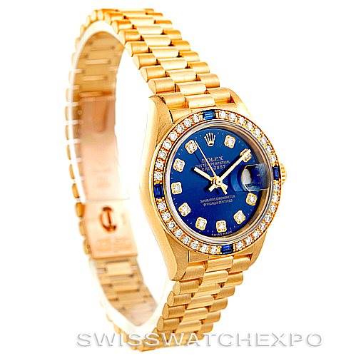 The Rolex President 69088 Women's Yellow Gold Blue Dial 69088 Women's Yellow Gold Blue Dial model watch is shown at an angled side view, highlighting its gold band and blue face with diamond markers.