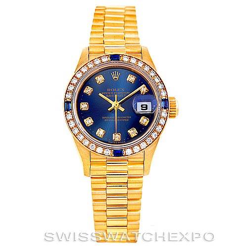 The image shows a Rolex President 69088 Women's Yellow Gold Blue Dial 69088 Women's Yellow Gold Blue Dial model watch from a front angle, highlighting the gold bracelet, blue dial, diamond markers, and date window.