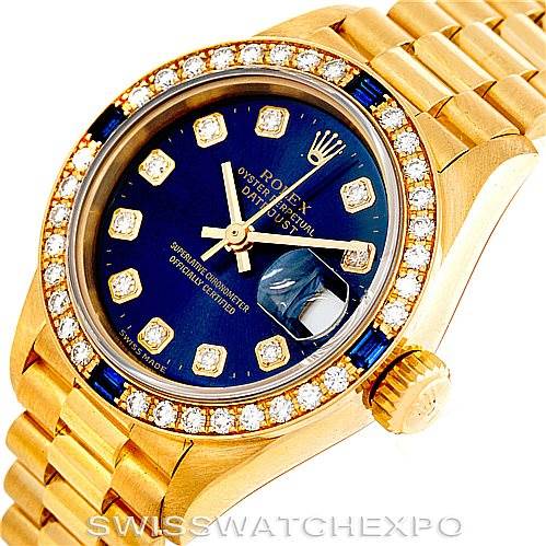 This image shows a close-up angle of the Rolex President 69088 Women's Yellow Gold Blue Dial 69088 Women's Yellow Gold Blue Dial model watch, highlighting the blue dial, gold casing, and diamond-studded bezel.