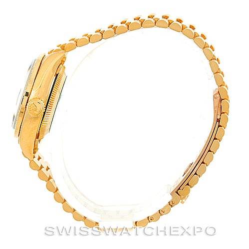 The image shows a side view of a Rolex President 69088 Women's Yellow Gold Blue Dial 69088 Women's Yellow Gold Blue Dial model, highlighting the crown, case, and part of the bracelet.