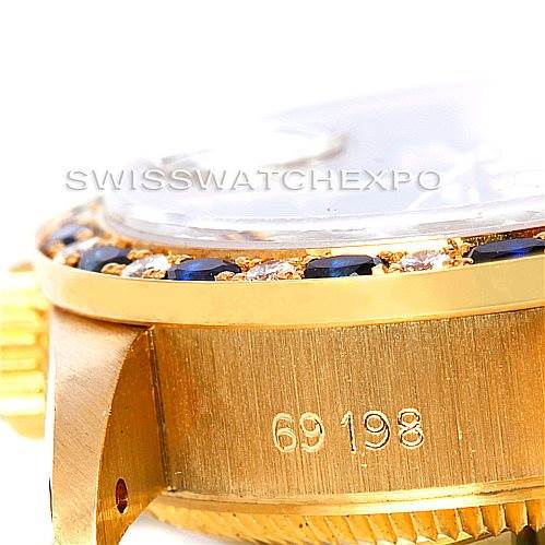The image shows a close-up side angle of the Rolex President 69198 Women's Yellow Gold Blue Dial 69198 Women's Yellow Gold Blue Dial model, focusing on the case, bezel, and visible serial number.
