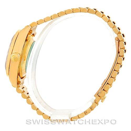 The image shows a side view of the President model by Rolex, highlighting its bezel, crown, and bracelet.