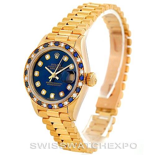 This image shows a gold Rolex President 69198 Women's Yellow Gold Blue Dial 69198 Women's Yellow Gold Blue Dial model watch at a slightly angled side view, highlighting its blue dial, diamond hour markers, and bracelet.