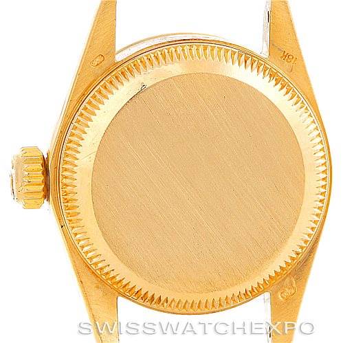 This image shows the case back and crown of the Rolex President 67198 Women's Yellow Gold Champagne Dial 67198 Women's Yellow Gold Champagne Dial model watch from a rear angle.