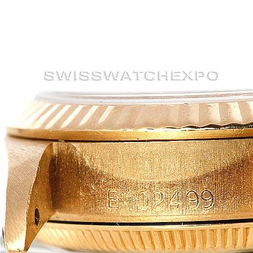 This image shows a close-up side view of the bezel and case of a Rolex President 67198 Women's Yellow Gold Champagne Dial 67198 Women's Yellow Gold Champagne Dial model watch, revealing part of the serial number.