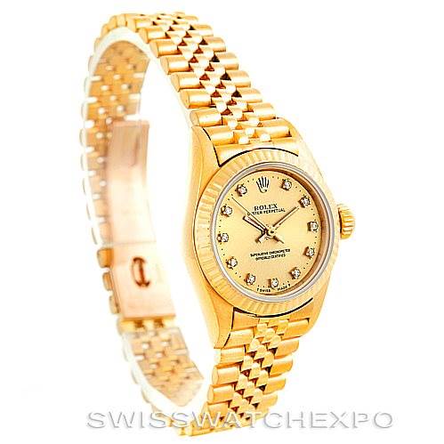 The image shows a side-angle view of a Rolex President 67198 Women's Yellow Gold Champagne Dial 67198 Women's Yellow Gold Champagne Dial model watch, highlighting its gold bracelet and diamond-accented dial.