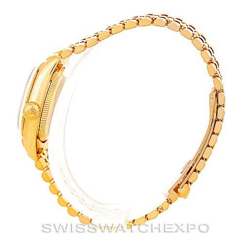 The image shows a side profile of a Rolex President 67198 Women's Yellow Gold Champagne Dial 67198 Women's Yellow Gold Champagne Dial model watch, highlighting its gold bracelet and crown.