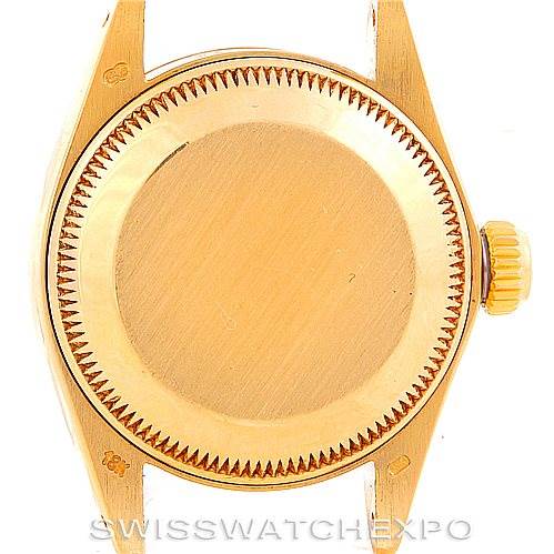 This image shows the back case and crown of a Rolex President 6917 Women's Yellow Gold Champagne Dial 6917 Women's Yellow Gold Champagne Dial model watch.