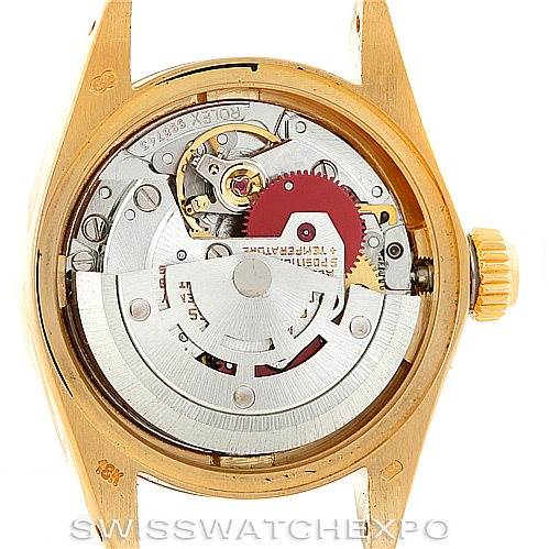 The image shows the back view of the Rolex President 6917 Women's Yellow Gold Champagne Dial 6917 Women's Yellow Gold Champagne Dial model, revealing its intricate internal movement and mechanics.