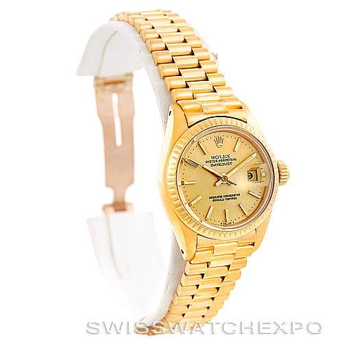 The Rolex President 6917 Women's Yellow Gold Champagne Dial 6917 Women's Yellow Gold Champagne Dial model watch is shown at a slightly angled side view, showcasing the gold case, dial, and bracelet.