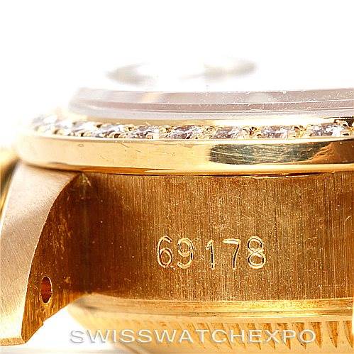 This close-up angle shows the side view of the Rolex President 69178 Women's Yellow Gold Black Dial 69178 Women's Yellow Gold Black Dial model 69178 casing with its serial number visible.