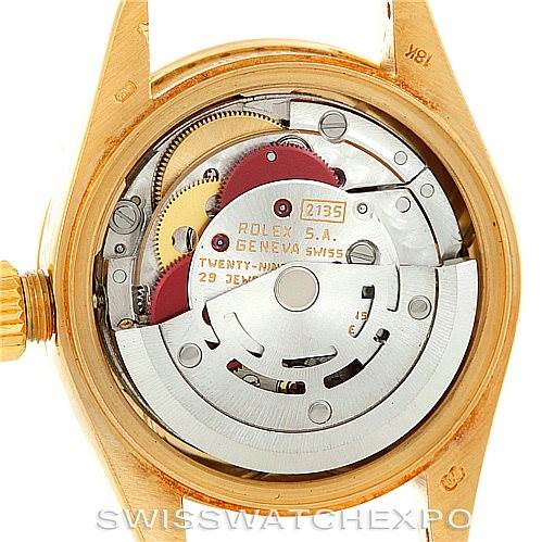 The image shows the back view of a Rolex President 69178 Women's Yellow Gold Black Dial 69178 Women's Yellow Gold Black Dial model, highlighting its movement and internal mechanisms.