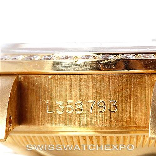 This image shows a close-up of the side of a Rolex President 69178 Women's Yellow Gold Black Dial 69178 Women's Yellow Gold Black Dial model watch, displaying its serial number.