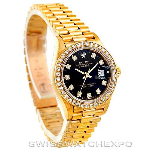 The Rolex President 69178 Women's Yellow Gold Black Dial 69178 Women's Yellow Gold Black Dial model watch is shown at a three-quarter angle, highlighting its gold bracelet, diamond-set bezel, and black dial.