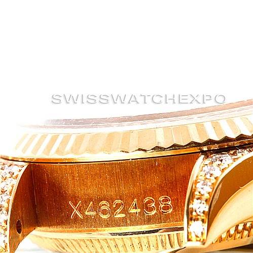 This is a close-up of the Rolex President 69238 Women's Yellow Gold Champagne Dial 69238 Women's Yellow Gold Champagne Dial model showcasing the serial number engraving and part of the diamond-studded bezel.