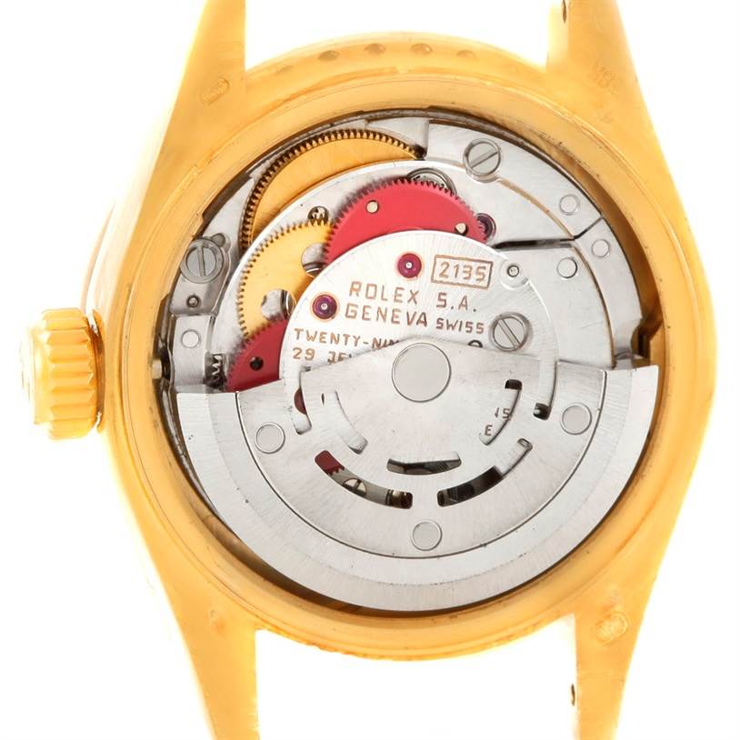 The image shows the internal mechanism of a Rolex President 69158 Women's Yellow Gold Black Dial 69158 Women's Yellow Gold Black Dial model watch from a rear angle.