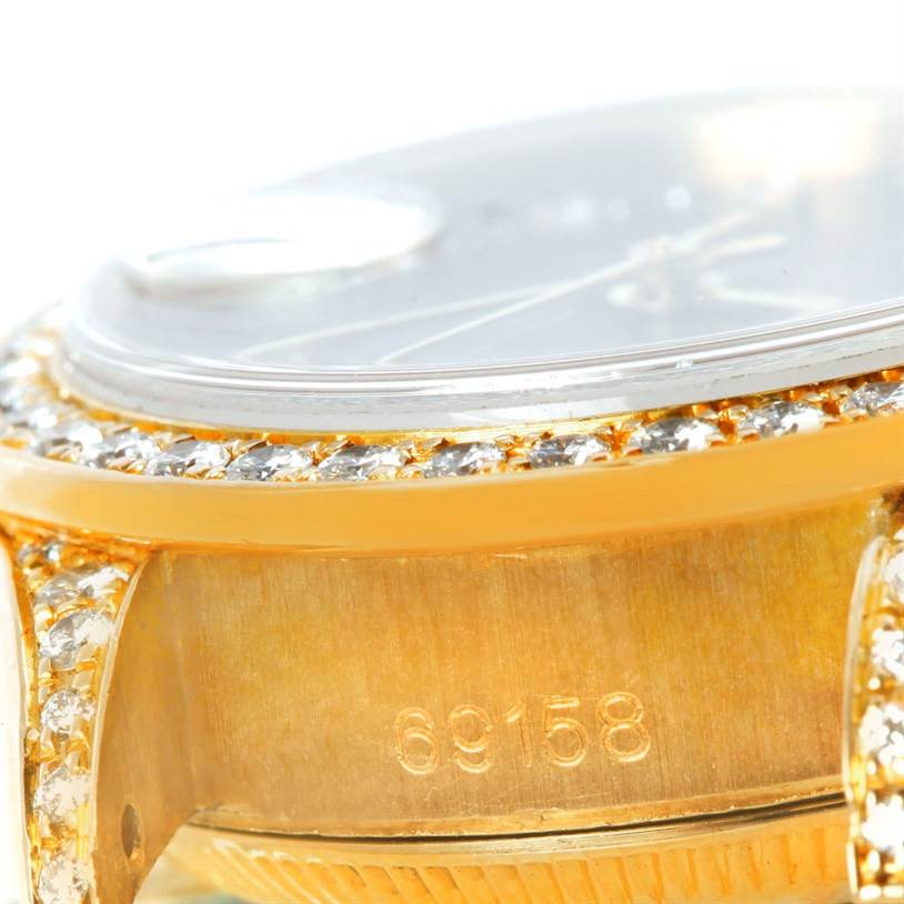 This close-up angle of the Rolex President 69158 Women's Yellow Gold Black Dial 69158 Women's Yellow Gold Black Dial model showcases its diamond-encrusted bezel and case with its model number "69158."