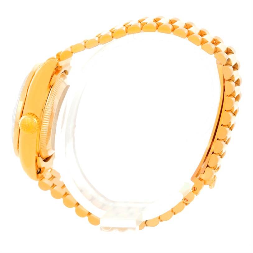 This image shows a side profile of the Rolex President 69158 Women's Yellow Gold Black Dial 69158 Women's Yellow Gold Black Dial model, highlighting the crown and the link bracelet.