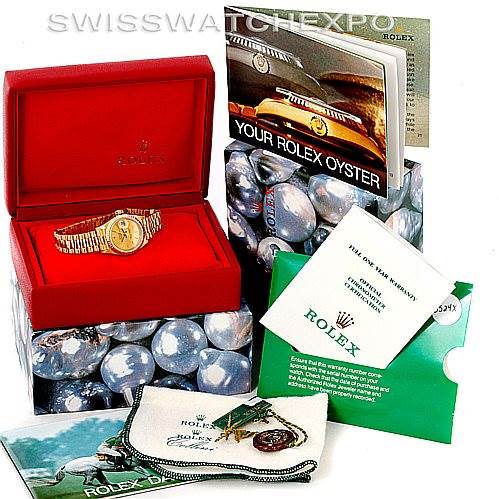 The image shows a Rolex President 69178 Women's Yellow Gold Champagne Dial 69178 Women's Yellow Gold Champagne Dial model watch in its box, with accompanying booklets, a cloth, and a tag viewed from above.