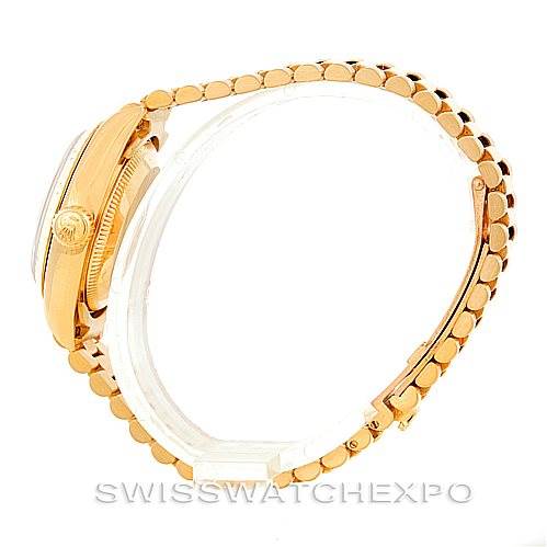 This image shows a side profile of a Rolex President 69178 Women's Yellow Gold Champagne Dial 69178 Women's Yellow Gold Champagne Dial model watch, highlighting its golden case, crown, and linked bracelet.