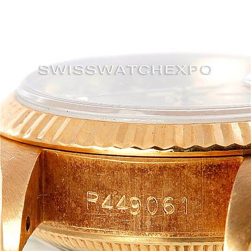 This image shows a close-up side view of the Rolex President 69178 Women's Yellow Gold Champagne Dial 69178 Women's Yellow Gold Champagne Dial model's case, highlighting the serial number and fluted bezel.
