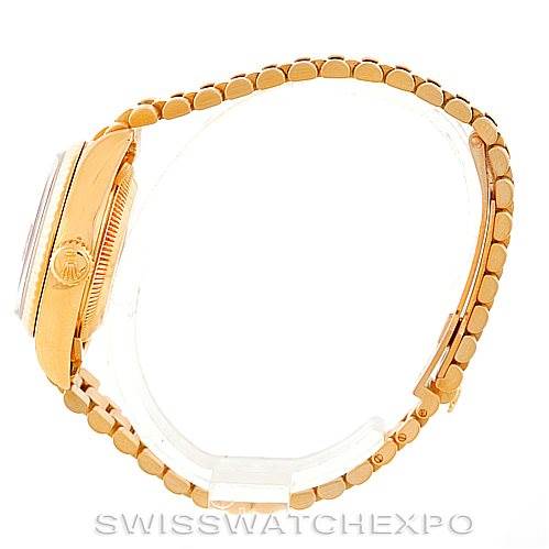 This side view shows the gold bracelet and case of a Rolex President 69178 Women's Yellow Gold Brown Dial 69178 Women's Yellow Gold Brown Dial watch.