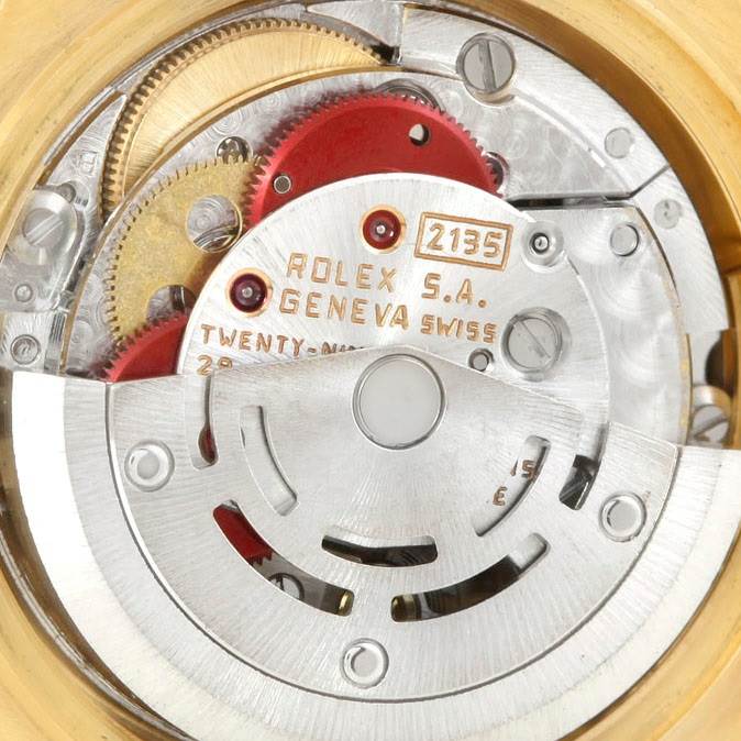 The image shows the internal movement mechanism of a Rolex President 69178 Women
s Yellow Gold Brown Dial 69178 Women
s Yellow Gold Brown Dial model including gears and engraving details.