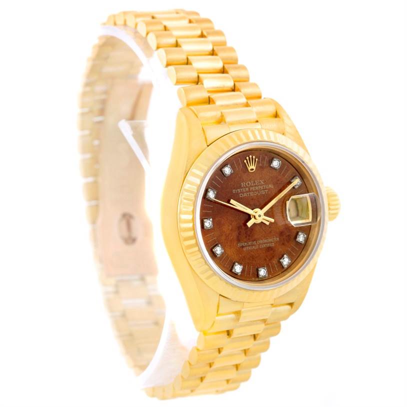 The image shows a Rolex President 69178 Women
s Yellow Gold Brown Dial 69178 Women
s Yellow Gold Brown Dial model watch from a right-side angle, highlighting the case, dial, bracelet, and date window.
