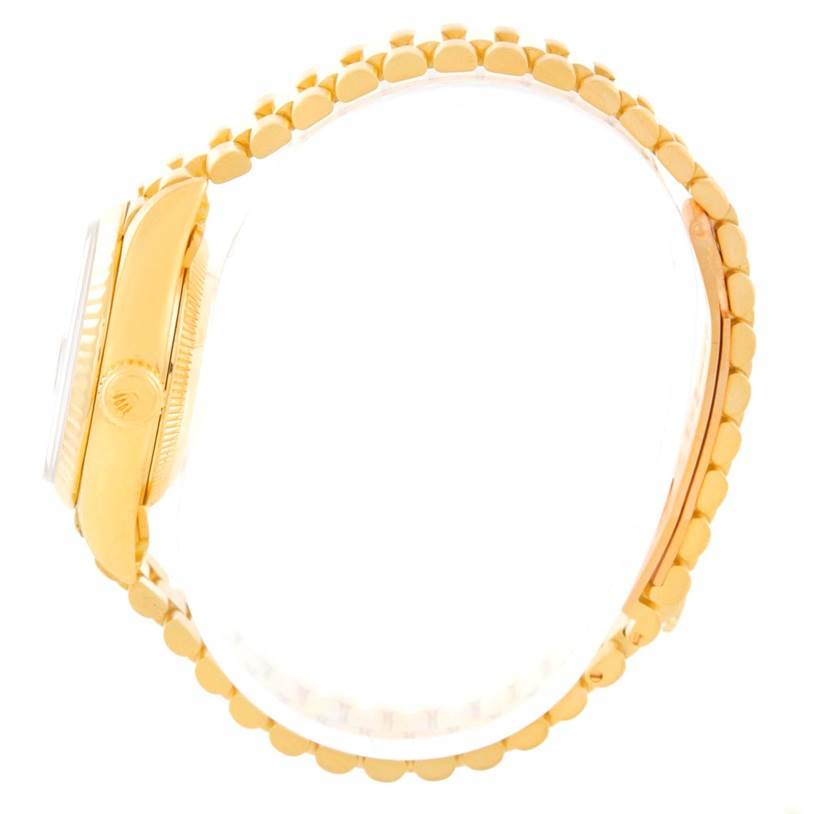 The image shows a side view of the Rolex President 69178 Women
s Yellow Gold Brown Dial 69178 Women
s Yellow Gold Brown Dial model watch, highlighting the case, crown, and part of the bracelet.