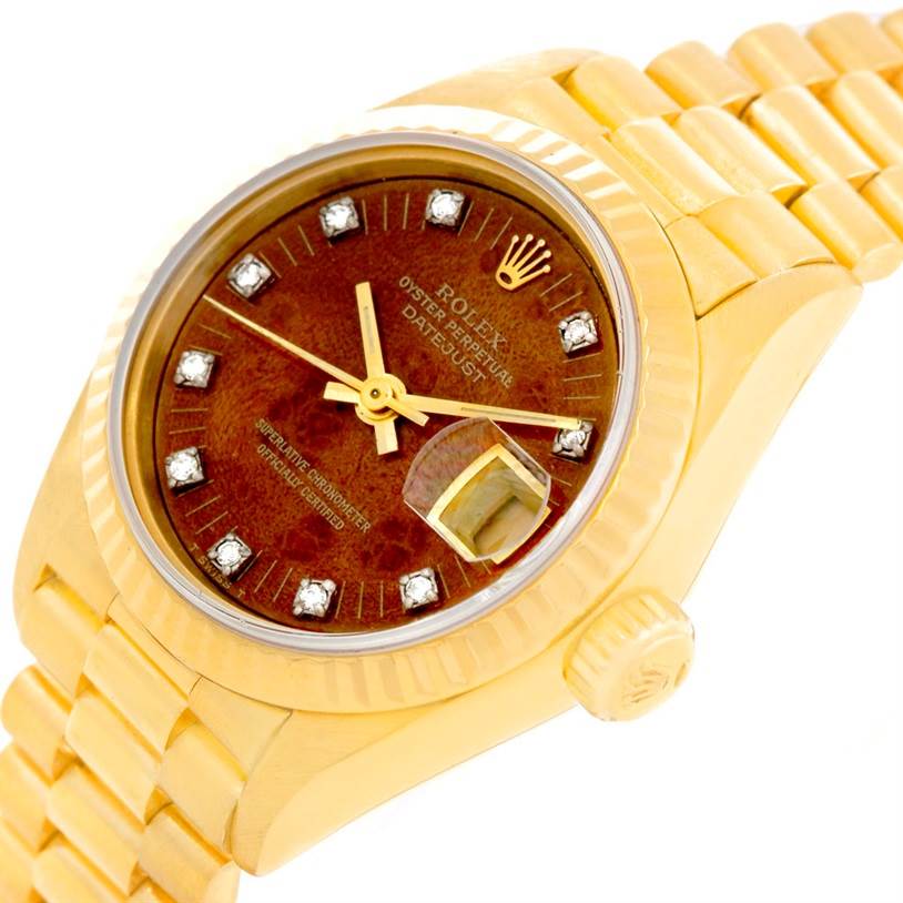 This image shows a tilted view of the Rolex President 69178 Women
s Yellow Gold Brown Dial 69178 Women
s Yellow Gold Brown Dial model watch, highlighting the dial, hands, bracelet, and crown.