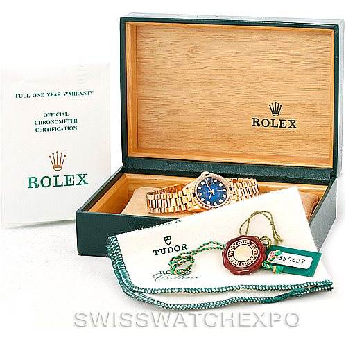 The image shows a Rolex President 69088 Women's Yellow Gold Blue Dial 69088 Women's Yellow Gold Blue Dial model watch in its box, along with a warranty card, certification document, and accessories.