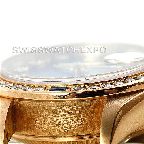 This close-up angle of the Rolex President 69088 Women's Yellow Gold Blue Dial 69088 Women's Yellow Gold Blue Dial model shows its side case, bezel with diamonds, and a partial view of the dial.