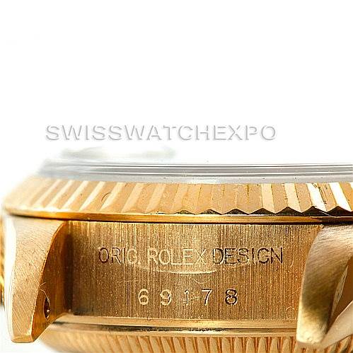 The image shows a close-up of the side of a Rolex President 69178 Women's Yellow Gold Champagne Dial 69178 Women's Yellow Gold Champagne Dial model watch, focusing on the bezel, part of the case, and the engraved model number.