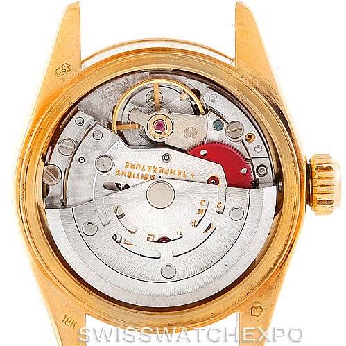The image shows the internal mechanics and movement of a Rolex President 69178 Women's Yellow Gold Champagne Dial 69178 Women's Yellow Gold Champagne Dial model watch from a top-down angle.