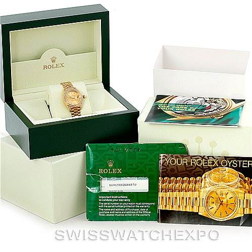 The image shows a Rolex President 69158 Women's Yellow Gold Champagne Dial 69158 Women's Yellow Gold Champagne Dial model watch and its accessories, including the box, warranty card, and user manual, viewed from the front.