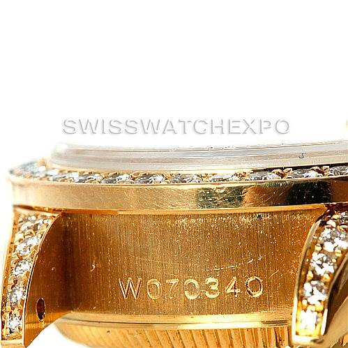 This image shows a close-up angle of the case side and lugs of a Rolex President 69158 Women's Yellow Gold Champagne Dial 69158 Women's Yellow Gold Champagne Dial model watch, displaying its engravings and diamond accents.